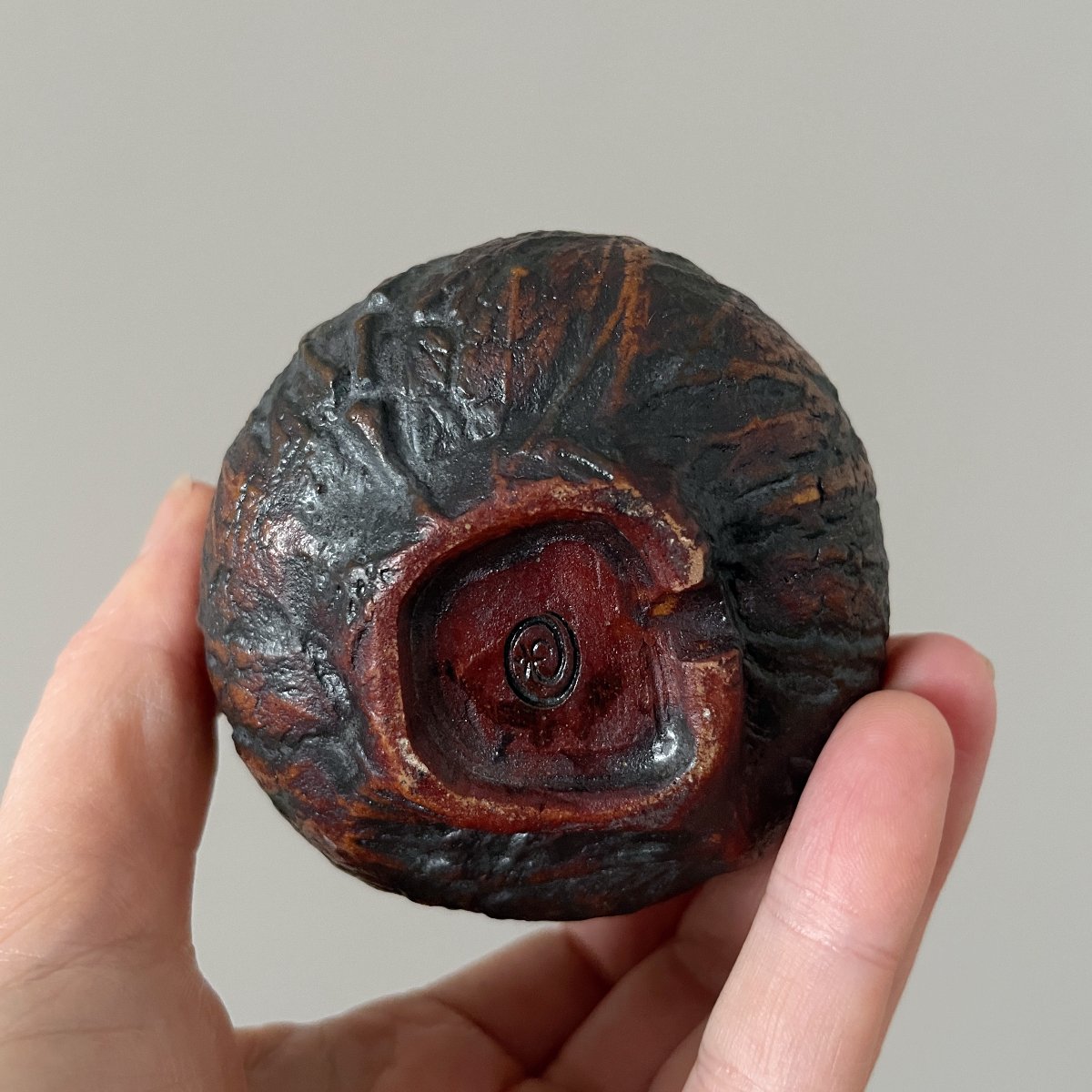 Bottom view of handmade ceramic yunomi showing foot ring