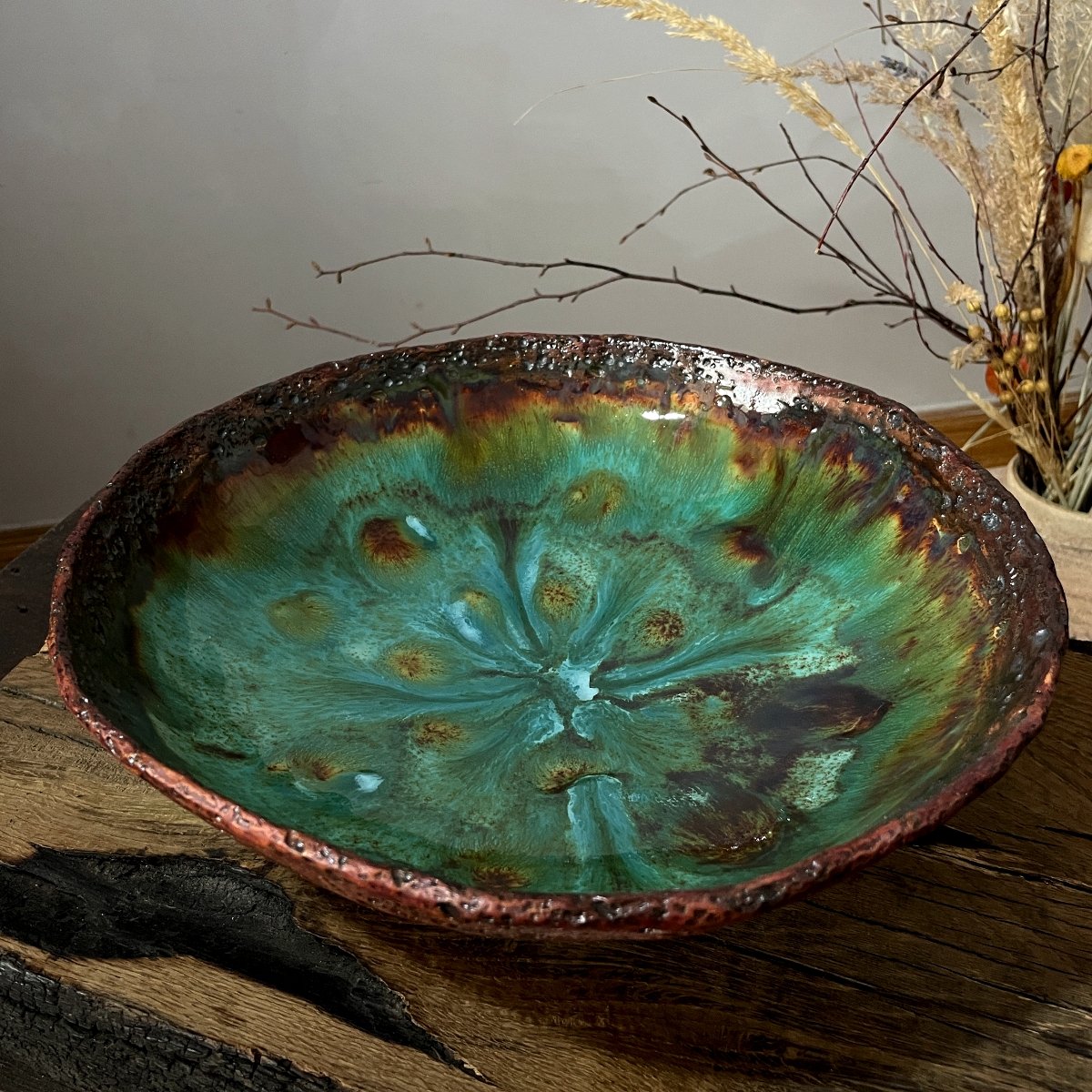 Handmade pottery fruit bowl with organic glaze patterns
