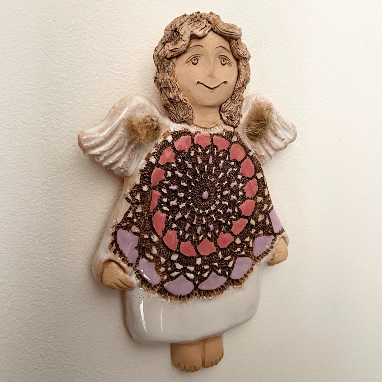 small handmade ceramic angel wall sculpture