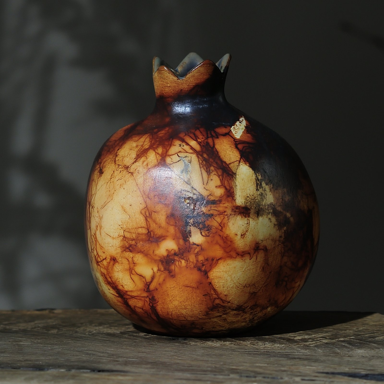 unique saggar fired pottery pomegranate vessel