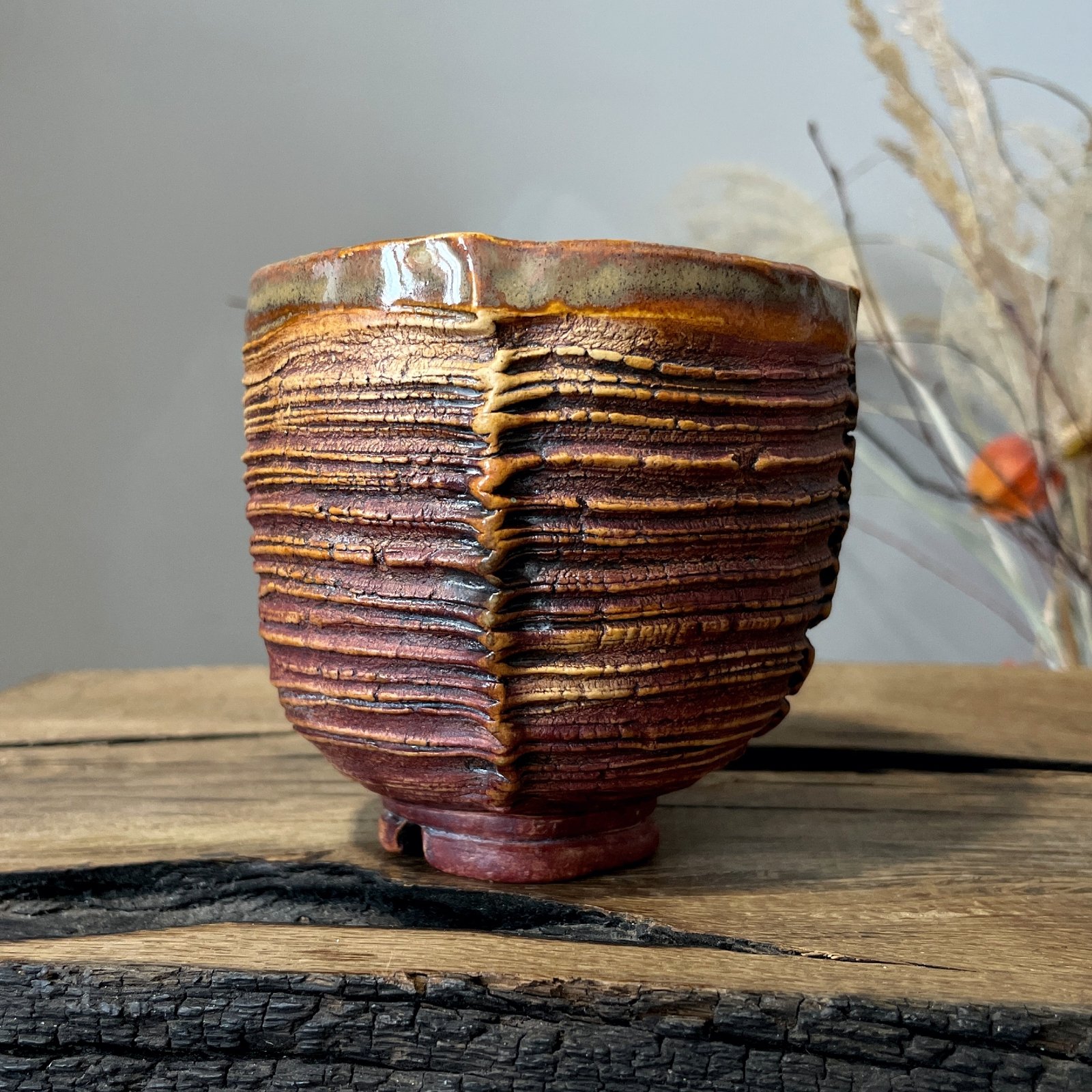 Ceramic yunomi cup with layered hand carved texture
