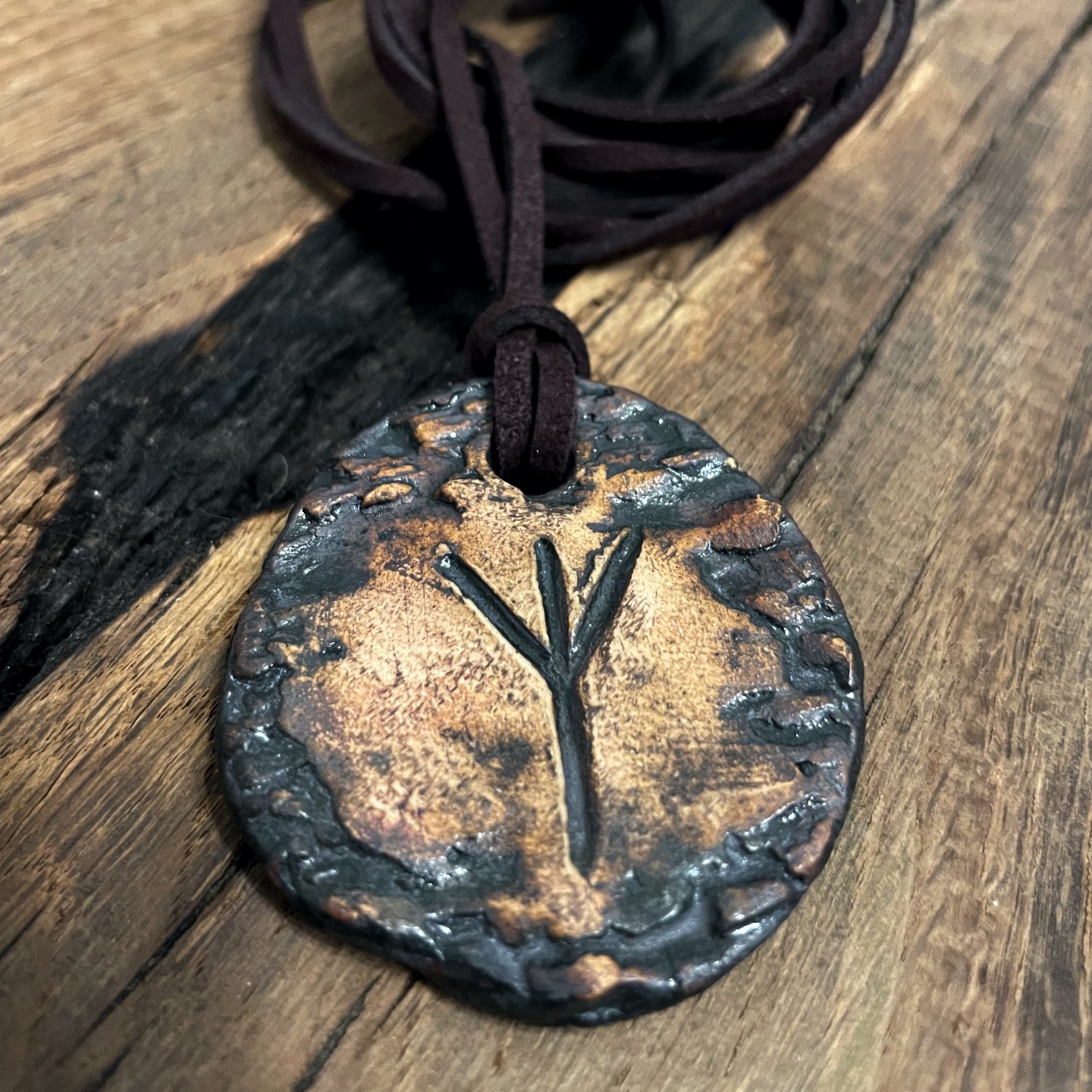 Handmade ceramic pendant with Algiz rune symbol