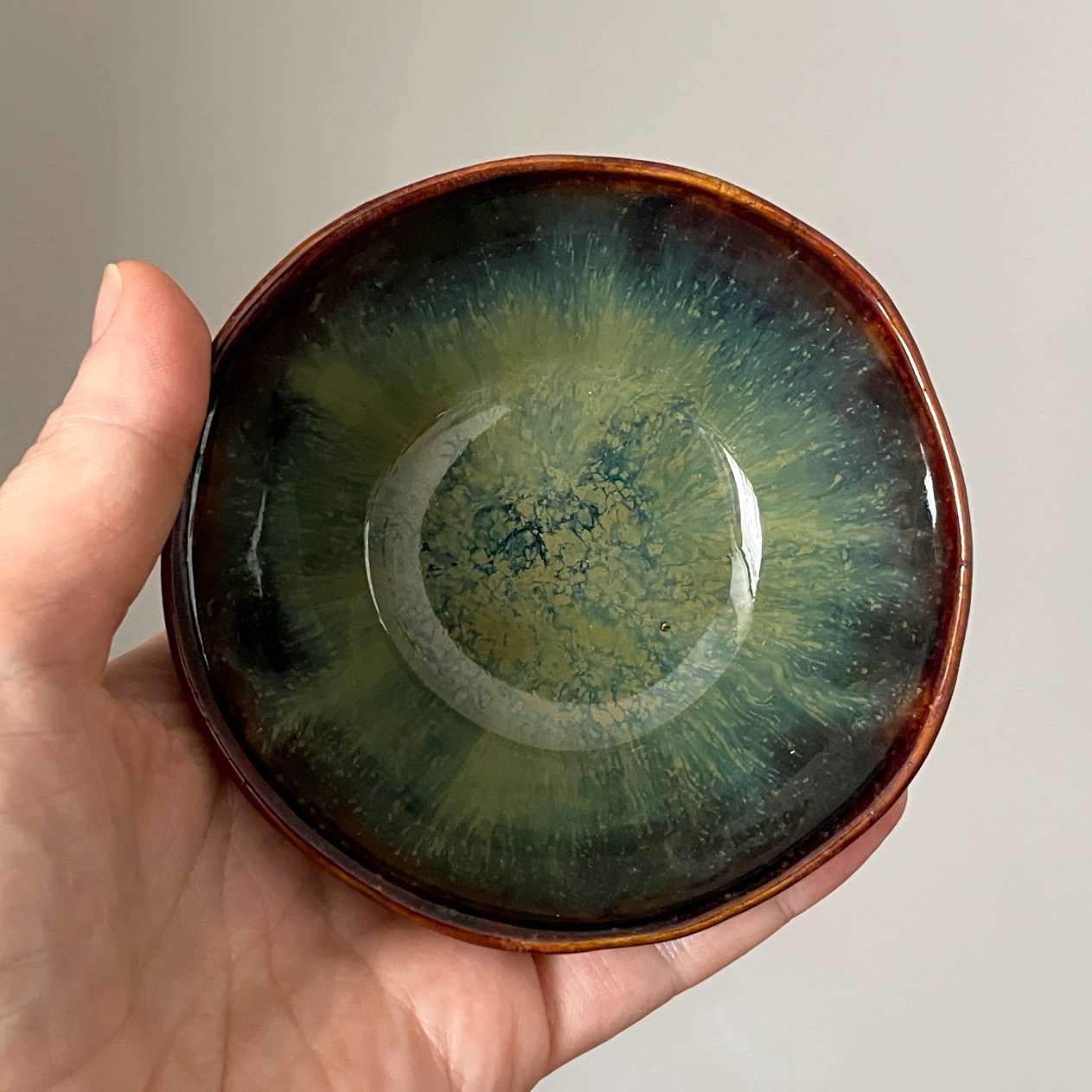 Small handmade ceramic side bowl with green glaze